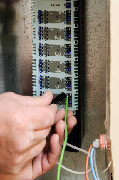 istock Switching signal wires in the home's heating system control. 658275210