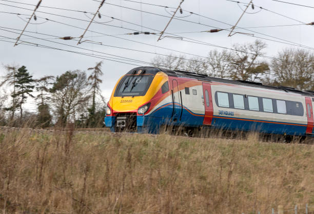 Passenger train St Albans, UK - March 6, 2017: British East Midlands train in motion midlands england stock pictures, royalty-free photos & images