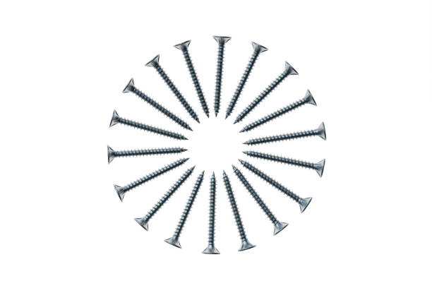 closeup of metal screws arranged in circle on white background