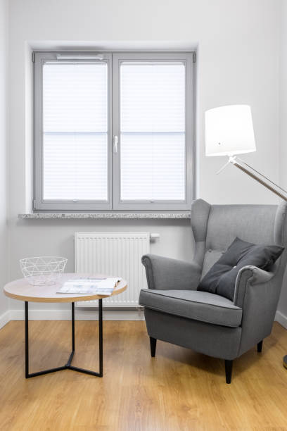 istock Stylish armchair with table 658281056