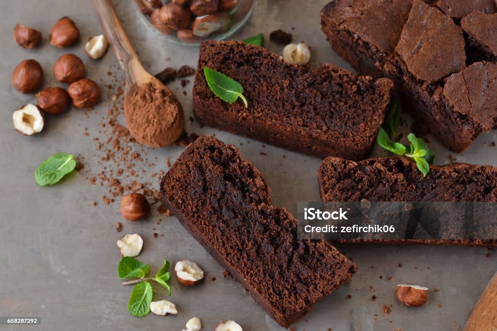 Homemade chocolate brownies with nuts on a metal, grunge background Hazelnut Stock Photo