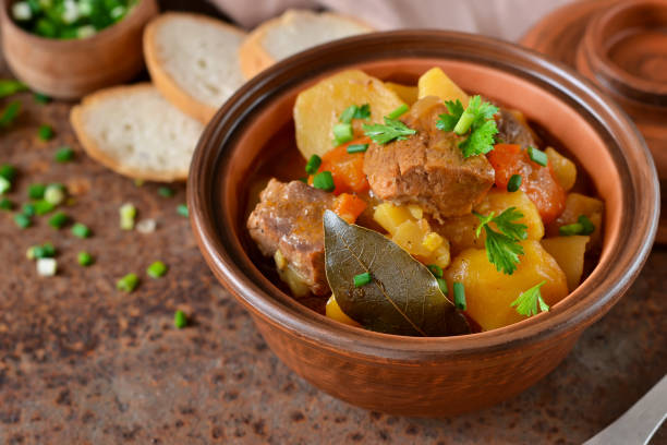 istock Stew with vegetables and potatoes on an old grunge background 658287356