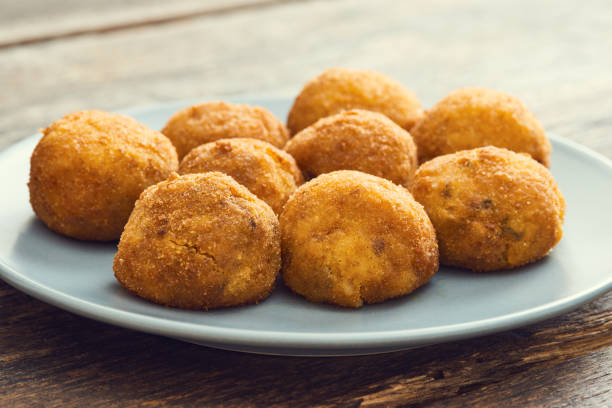 istock Arancini (deep fried rice balls with meat) Typical Sicilian street food 658287500