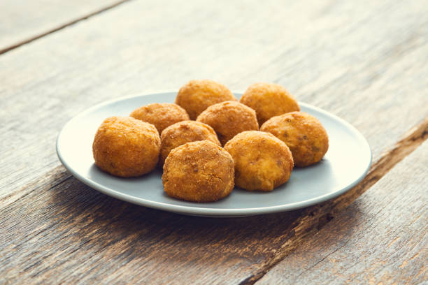 istock Arancini (deep fried rice balls with meat) Typical Sicilian street food 658287502