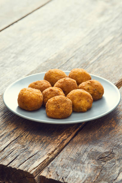 istock Arancini (deep fried rice balls with meat) Typical Sicilian street food 658287524