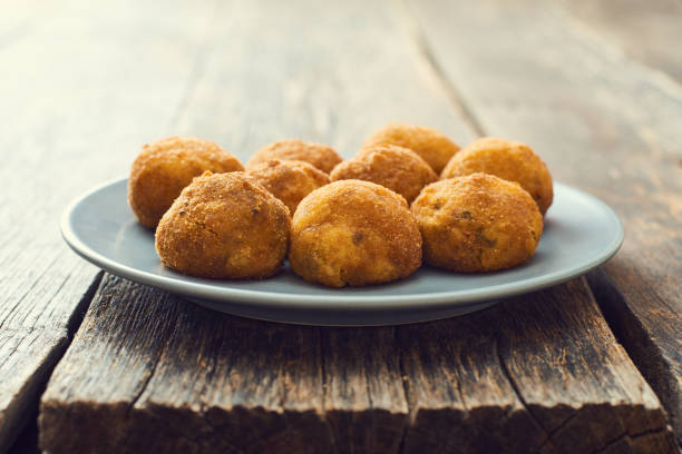 istock Arancini (deep fried rice balls with meat) Typical Sicilian street food 658287538