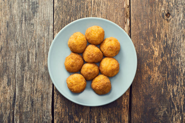 istock Arancini (deep fried rice balls with meat) Typical Sicilian street food 658287544
