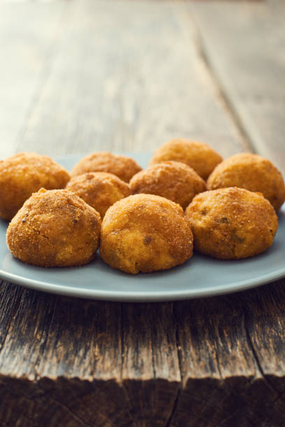 istock Arancini (deep fried rice balls with meat) Typical Sicilian street food 658287564