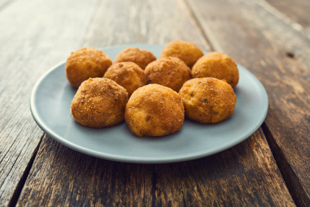 istock Arancini (deep fried rice balls with meat) Typical Sicilian street food 658287566