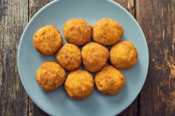 istock Arancini (deep fried rice balls with meat) Typical Sicilian street food 658287568