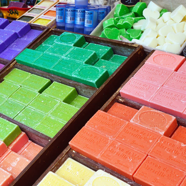 French soap PROVENCE, FRANCE - JULY 6, 2014: French soap in various color displayed in a street market in public street. Local soap the most popular souvenir in Provence etela savo finland stock pictures, royalty-free photos & images