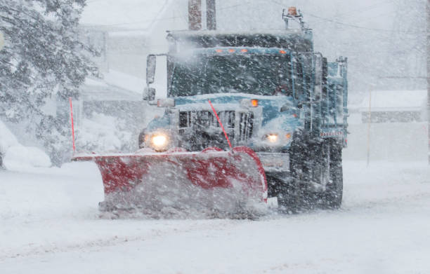istock Snow Plow doing its job in a storm 658291616