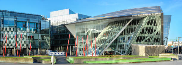 Panoramic image of Grand Canal Square in modern part of Dublin Docklands DUBLUN, IRELAND- February 4, 2017: Panoramic image of Grand Canal Square in Dublin Docklands (Silicon Docks). Accenture's Global Head Office on the left and the Bord Gais Energy Theatre on the right. modern geisha stock pictures, royalty-free photos & images