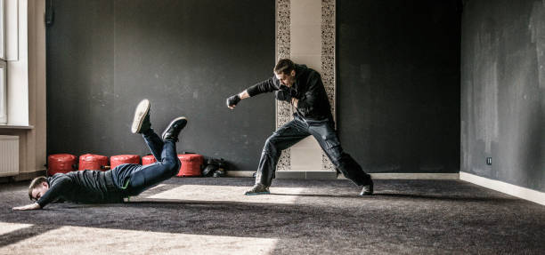 istock The defensive trowing of the attacker. The multi-image sequence with different phases of the single action. Krav Maga practice: the self-defense martial art developed for the Israel Army. Minsk, Belarus. 658297770