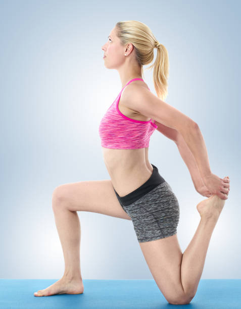istock Young woman stretching 658304850