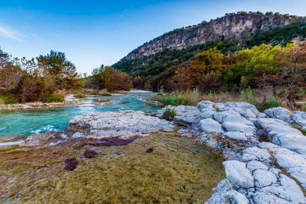 istock Fall foliage on the crystal clear Frio River in Texas. 658308030