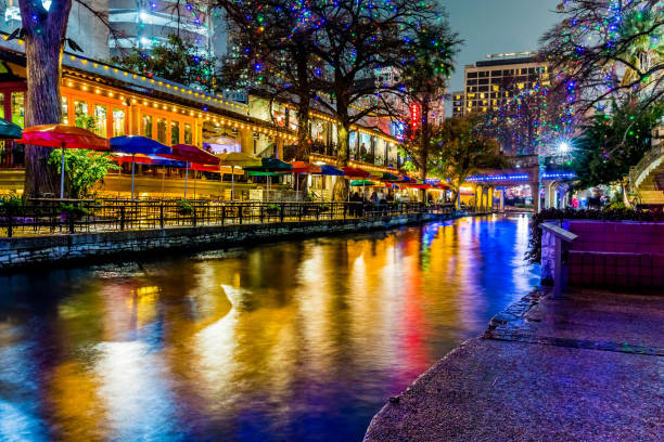 The Riverwalk at San Antonio, Texas, at Night. Night Time Scenic Views of the Riverwalk with Christmas Lights on a Rainy Day at San Antonio, Texas. arch bridge photos stock pictures, royalty-free photos & images