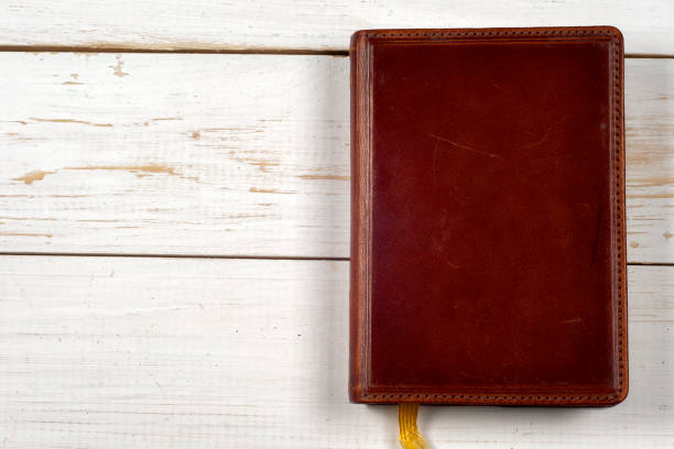 istock book, antique wood background 658311114