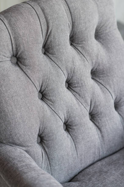 istock Seamless background texture close up of a grey sofa back with button detail on a thick cloth 658314766