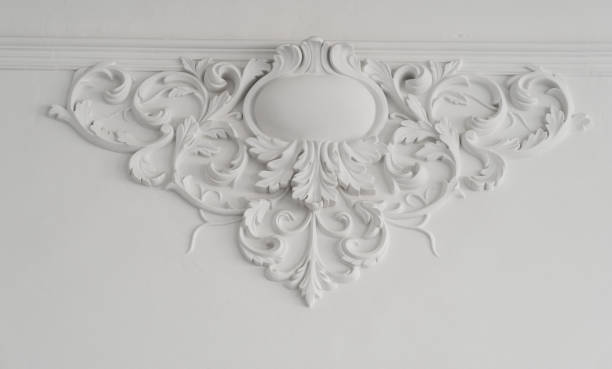 istock White wall molding with geometric shape and vanishing point. Luxury white wall design bas-relief with stucco mouldings roccoco element 658314820