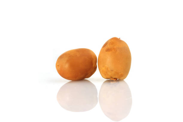 istock Yellow Dates fruits on white Background 658322160