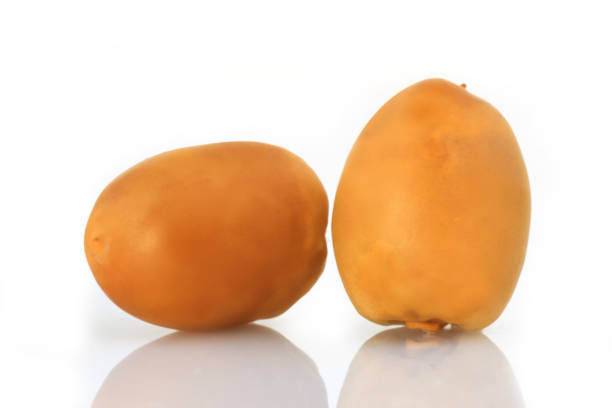 istock Yellow Dates fruits on white Background 658322166