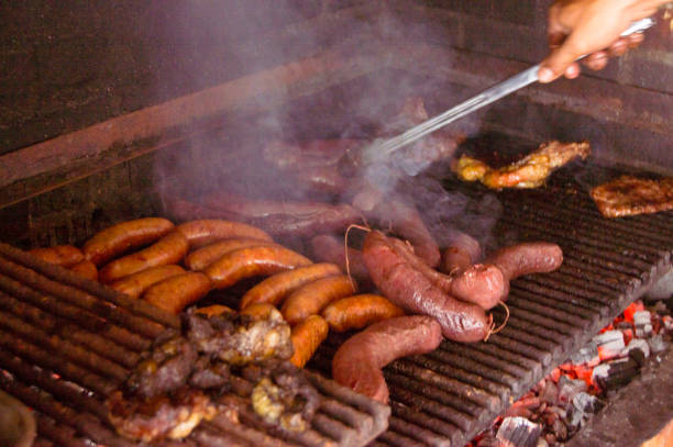 istock barbecue girll moved up the sausage 658324860