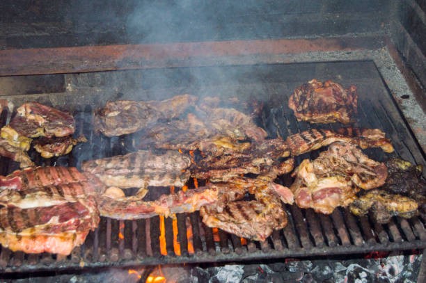 istock barbecue girll meat ,smoke up 658324896