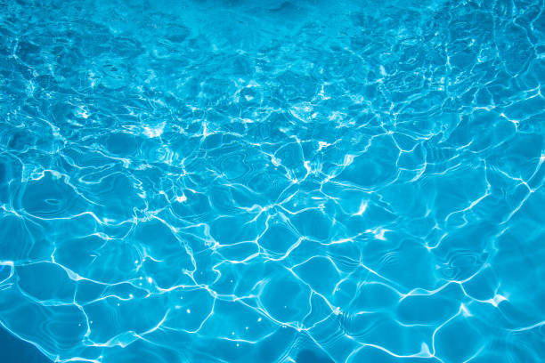istock Beautiful ripple wave and blue water surface in swimming pool 658325912