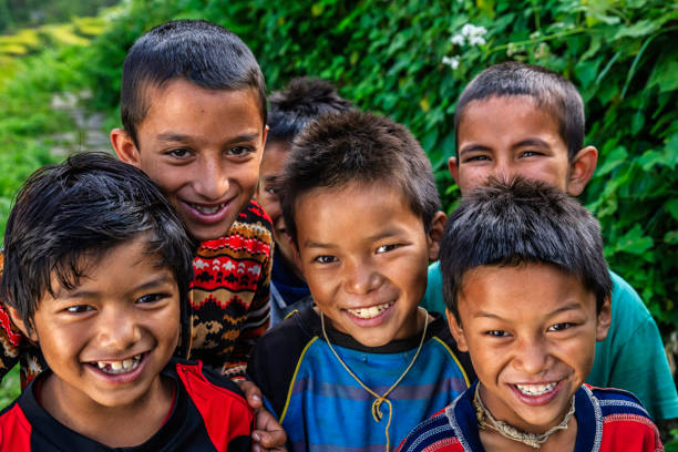 istock Group of happy Nepali boys near Annapurna Range 658325962