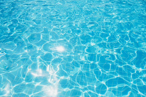 istock Blue and bright ripple water and surface in swimming pool 658329850