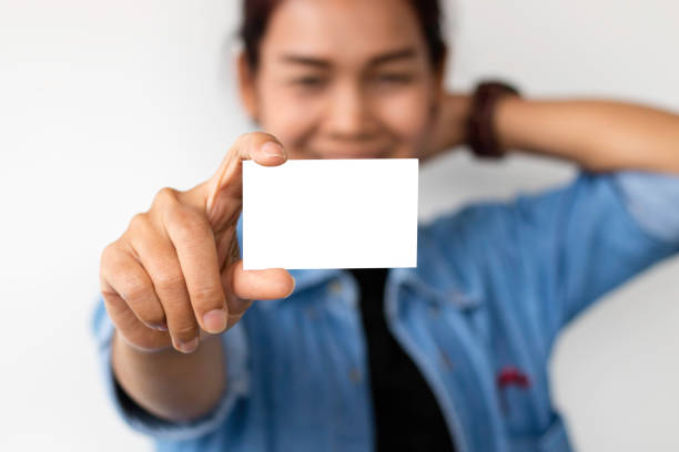 istock Asian woman holding empty white card 658332166