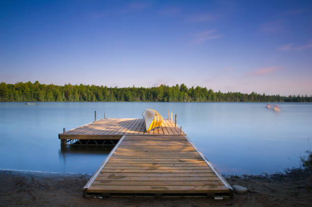 istock Yellow canoe on a lake deck 658336758