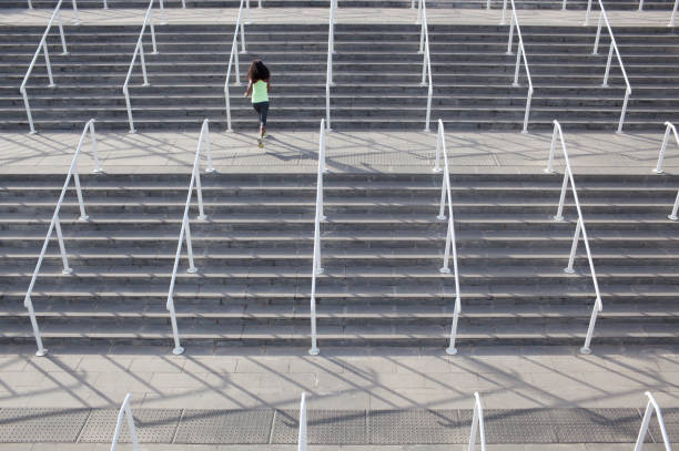 istock Woman running on stairs. 658339526