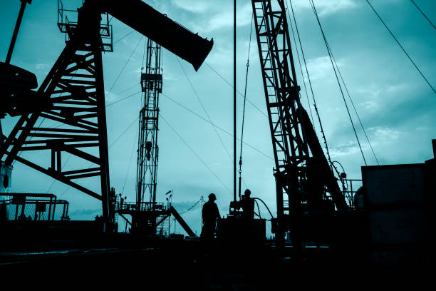 istock oil field, the oil workers are working 658339790