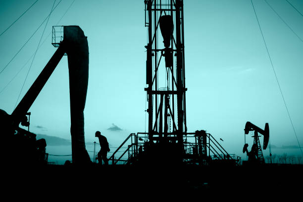 istock oil field, the oil workers are working 658339846