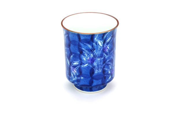 Traditional, handcrafted ceramic on bright wooden background. Soft focus. Close up.