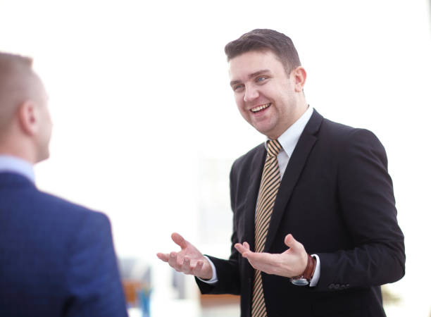 istock Two business colleagues at meeting in modern office interior 658350666