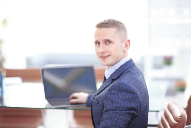 istock Young businessman working with laptop at modern office 658351902