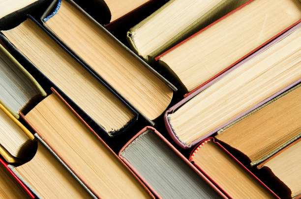 istock a stack of colorful books in a library 658351938