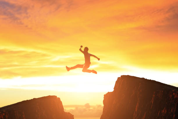 istock man jump in moutain 658354662
