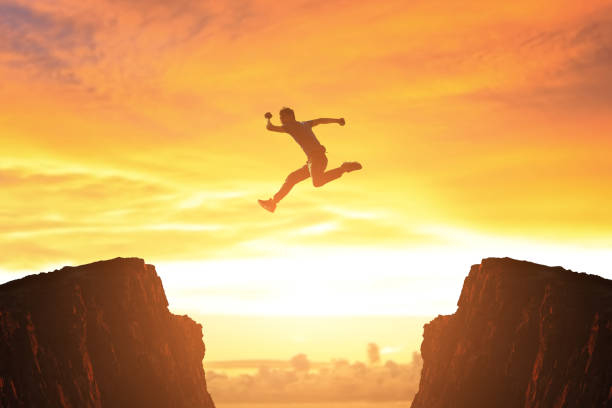 istock man jump in moutain 658354688
