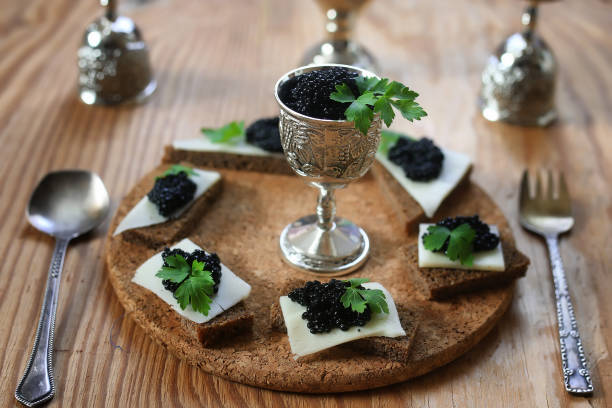 istock snack black caviar on a wooden background 658363202