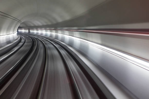 istock Blurred motion subway moving into tunnel, abstract background 658368090
