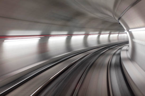 istock Blurred motion subway moving into tunnel, abstract background 658368720