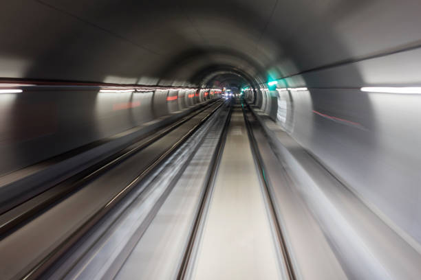 istock Blurred motion subway moving into tunnel, abstract background 658371026