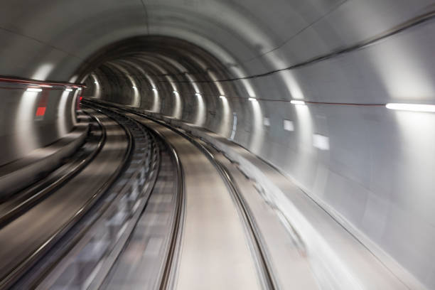 istock Blurred motion subway moving into tunnel, abstract background 658371216