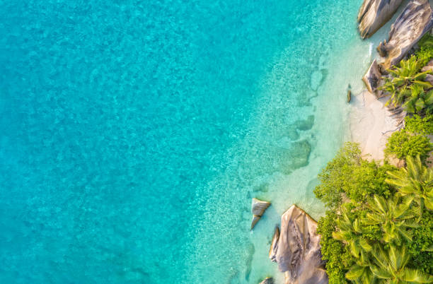 Aerial photo of tropical Seychelles beach at La Digue island Aerial photo of beautiful paradise Seychelles tropical beach Anse Source D Argent at La Digue island. Summer vacation and travel concept la digue island photos stock pictures, royalty-free photos & images