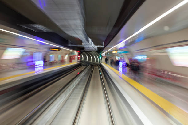 Blurred motion subway moving into tunnel, abstract background