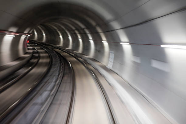 istock Blurred motion subway moving into tunnel, abstract background 658371662